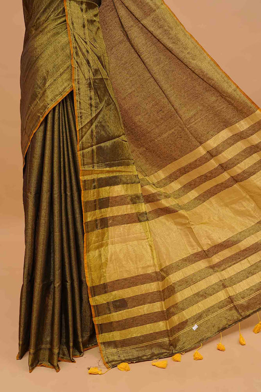 Green Colour & Gold Shade Tissue Mul Cotton Saree Featuring Plain body. With out Border Golden Strips on pallu comes With Tassels