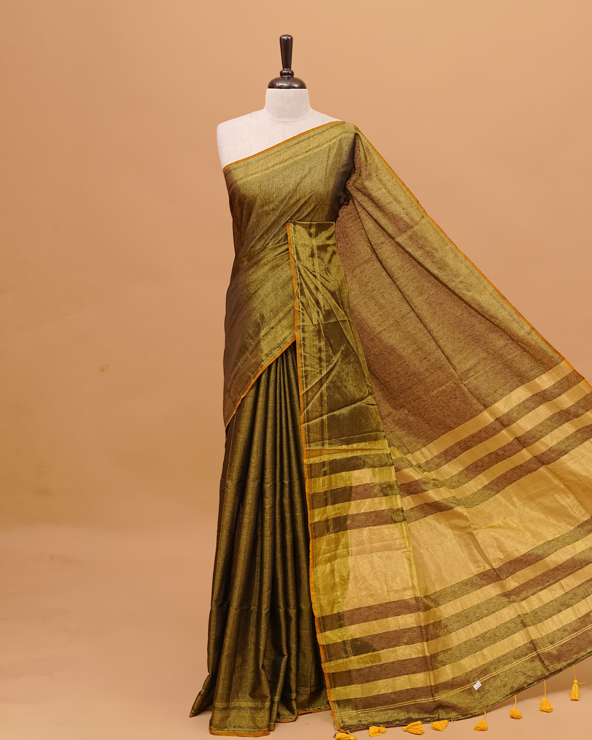 Green Colour & Gold Shade Tissue Mul Cotton Saree Featuring Plain body. With out Border Golden Strips on pallu comes With Tassels
