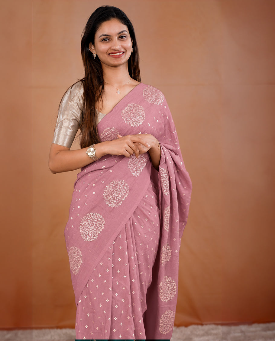 Light Onion Pink colour vijithra silk saree featuring small zari details on body, Tree design border.