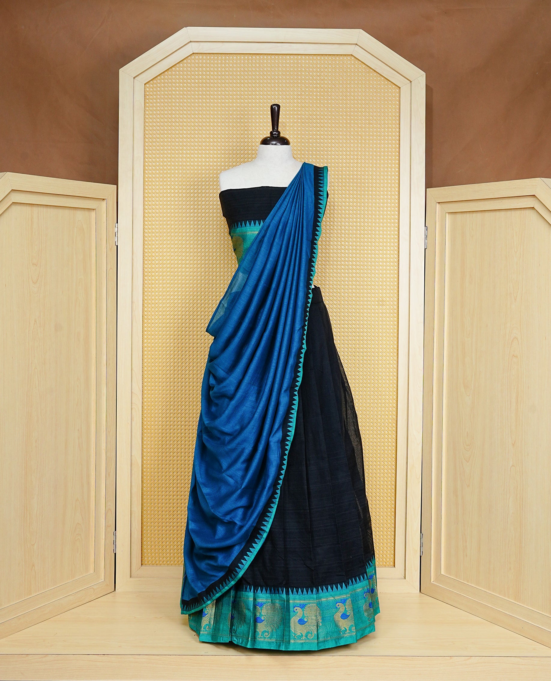 Black colour Semi Stitched Dhavni set Featuring Black Skirt With Contrast Green colour with Zari border, paired with UnStitched Blouse & Elegant Dupatta.