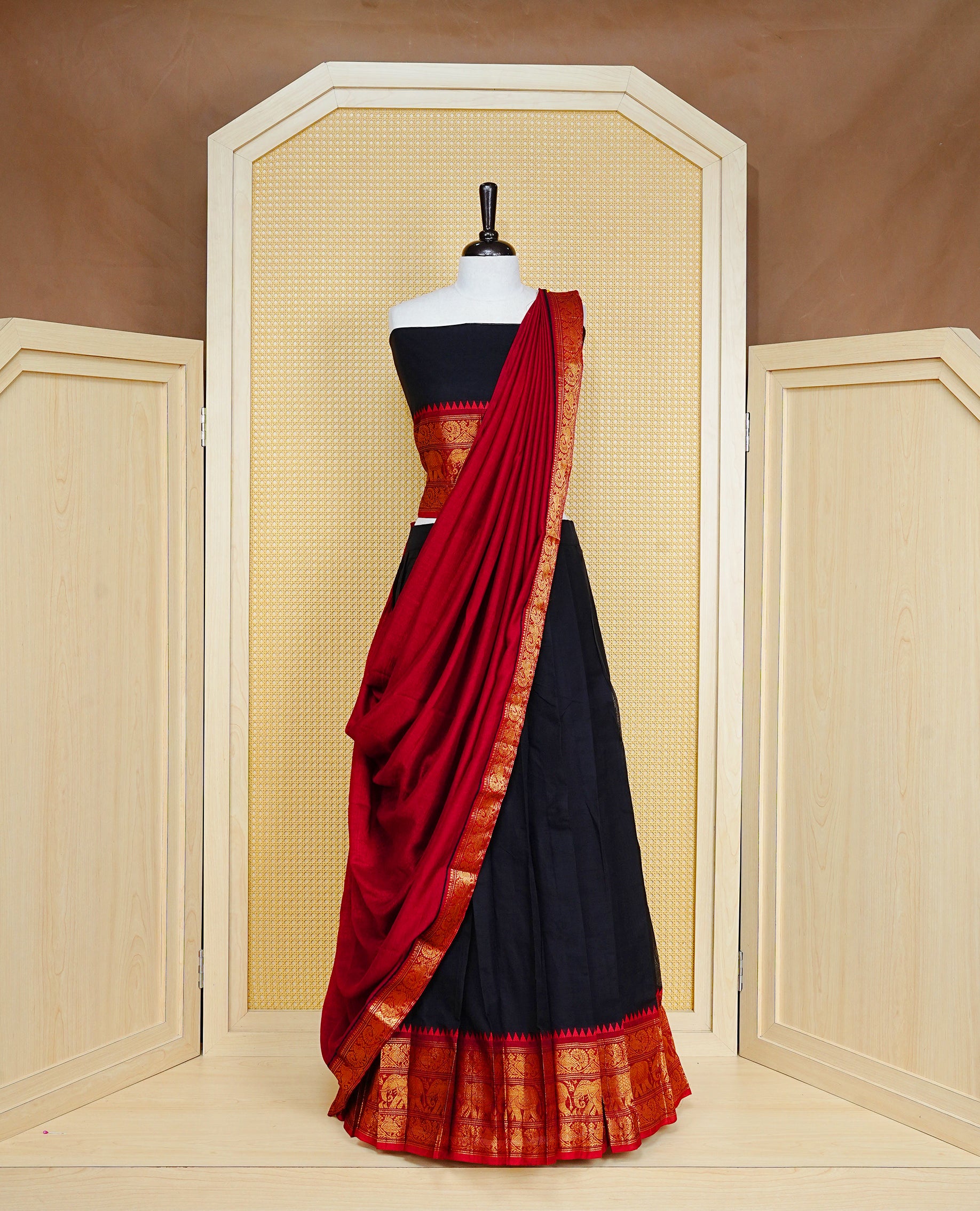 Black colour Semi Stitched Dhavni set Featuring Black Skirt With Contrast Red colour with Zari border, paired with UnStitched Blouse & Elegant Dupatta.