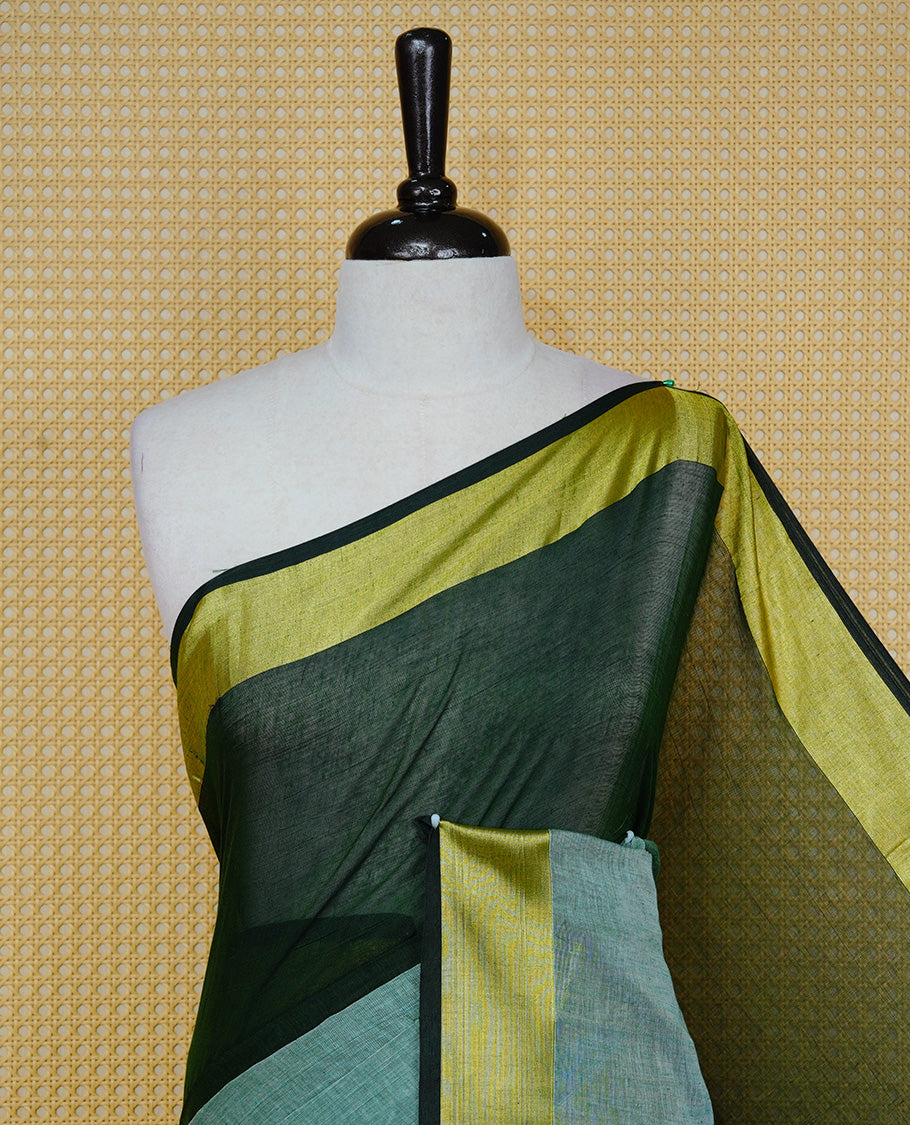 Dark Green with Mint Green Dual colour Mul cotton saree featuring Half & Half Dual Tone Plain Body, Complemented by Gold tissue Border & pallu.