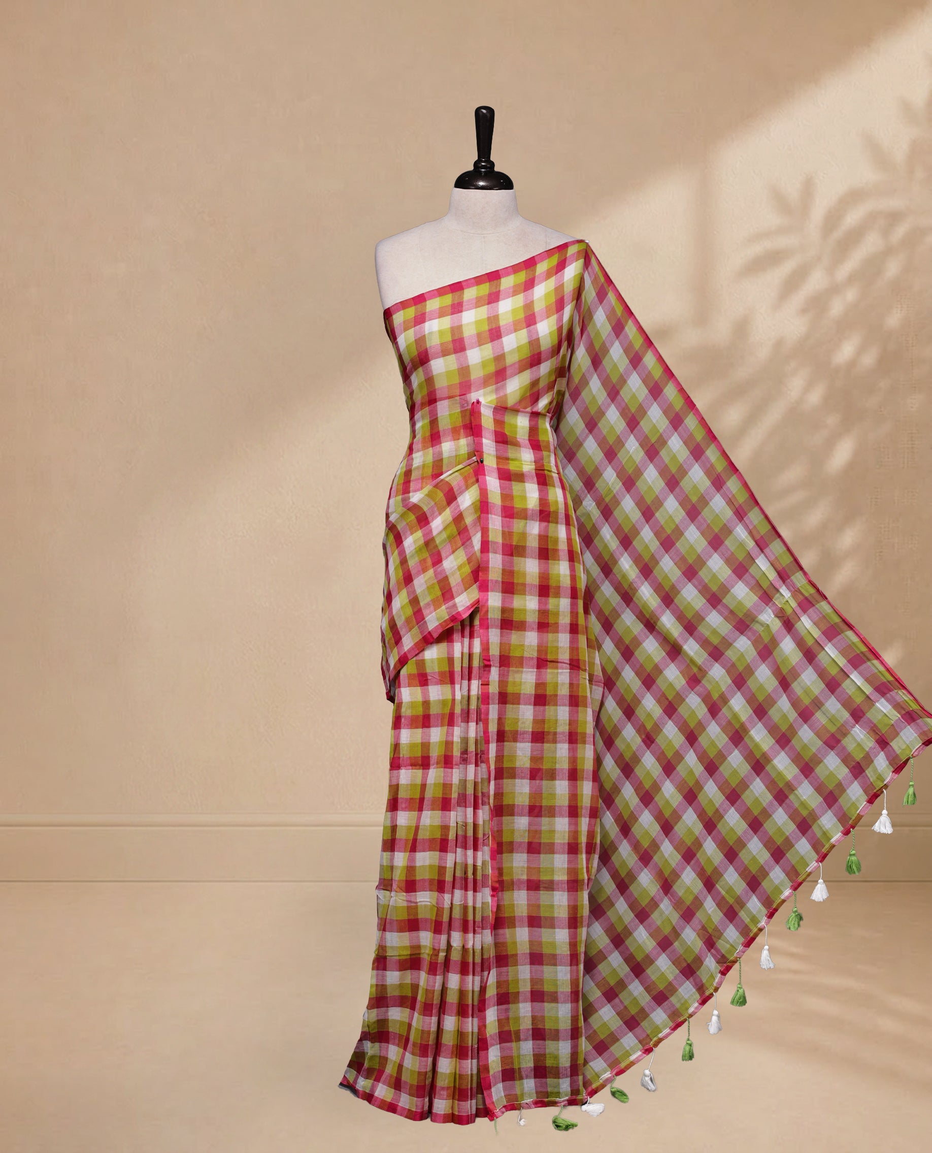 Pink & Green colour Khadi Mul cotton saree featuring Check Pattern on body,Enhanced Minimalist Borderless Finish & elegant Tassels at pallu.