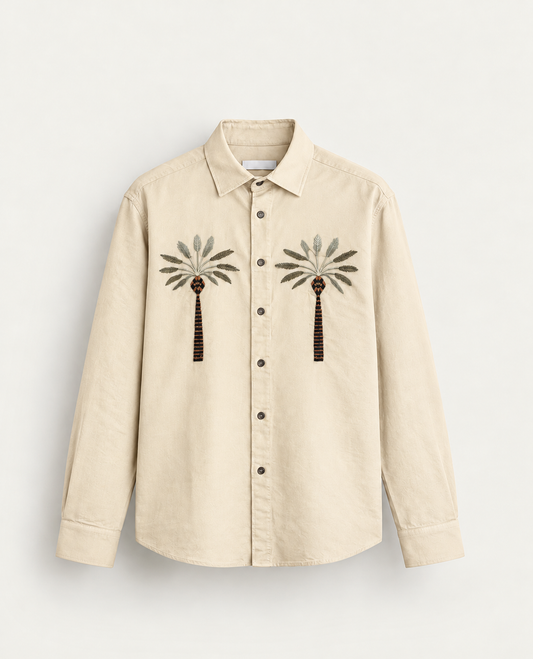 Cream colour full sleeve shirt with a tree embroidery pattern on the body.