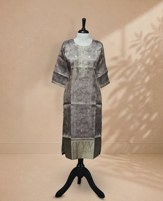 Grey colour Kurti featuring an intricate floral pattern, a round neckline adorned with detailed Stone & thread work, and 3/4 sleeves Design