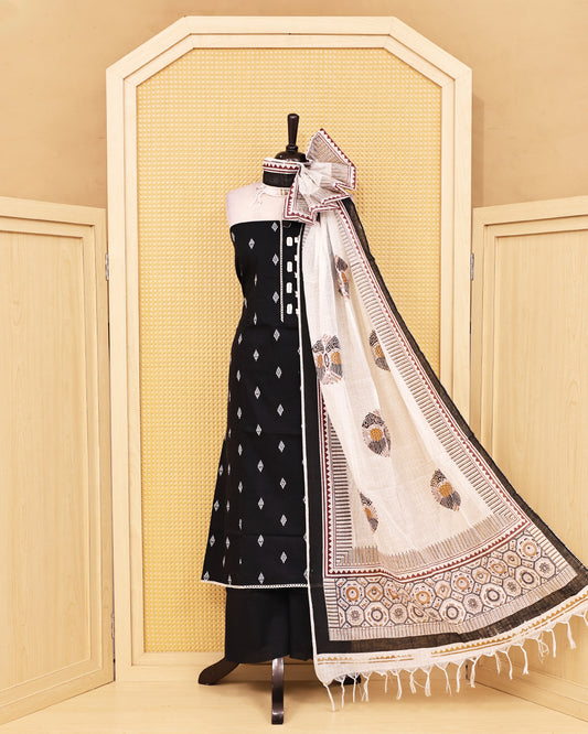 Black colour Cotton salwar material featuring Thread with mirror work on body, paired with matching bottom & dupatta.