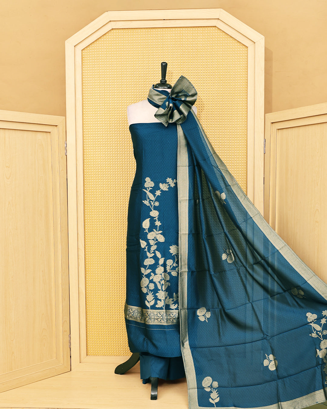 Blue colour Banaras salwar material featuring Zari floral work on body, paired with Matching bottom & dupatta.