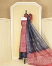 Light Red colour with Batik Printed chanderi Salwar Material paired with a deep Slate Blue printed bottom and a stunning contrast dupatta featuring elegant leaf motifs on borders