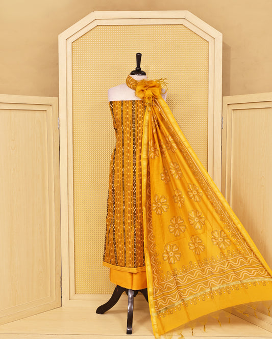 Mustard Yellow colour Cotton Salwar Material featuring elegant ikat inspired vertical stripes on the kurta, paired with a matching solid bottom and a beautifully printed dupatta