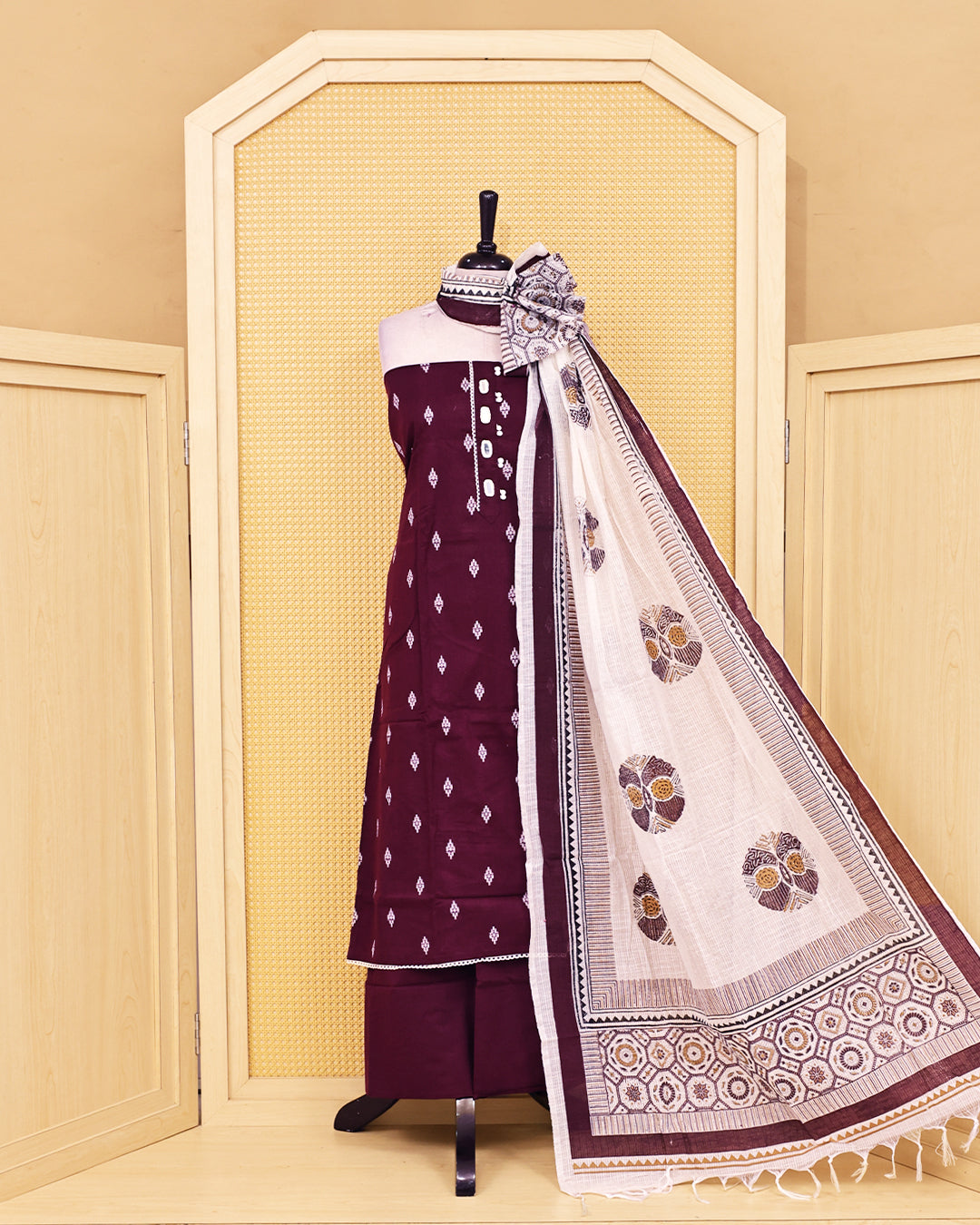 Wine colour Cotton salwar material featuring Thread with mirror work on body, paired with matching bottom & dupatta.