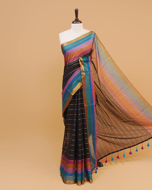 Black colour  mul cotton saree featuring a striped body, vibrant multicolour border, and striped pallu. Comes without a blouse piece.