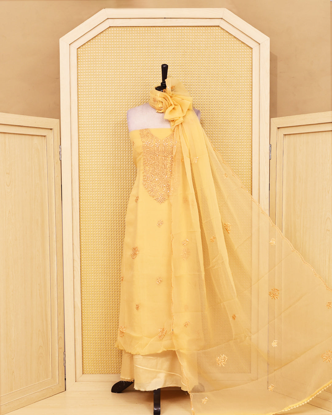Pastel Yellow colour Crush organza salwar material featuring thread work on body, paired with Matching bottom & dupatta.