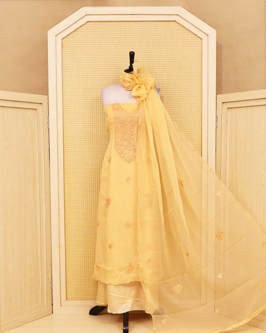 Pastel Yellow colour Crush organza salwar material featuring thread work on body, paired with Matching bottom & dupatta.