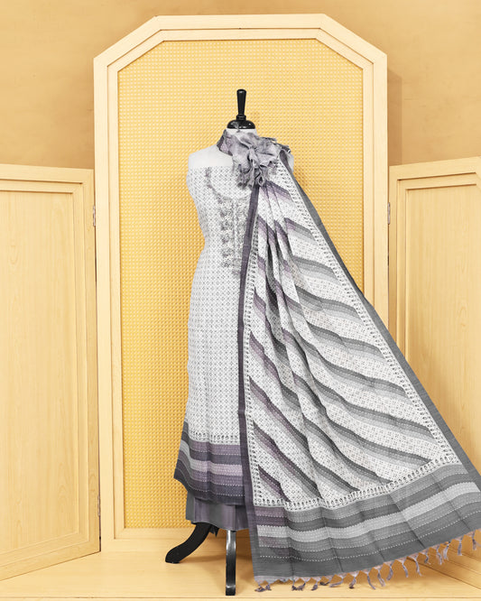 Off White colour Linen salwar material featuring Thread work with print on body, paired with Contrast Greyish Blue colour bottom & dupatta.