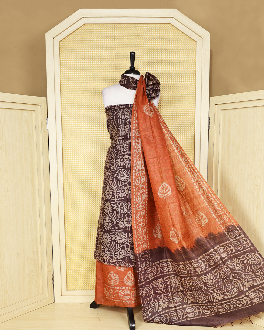 Brown colour with  Batik Printed chanderi Salwar Material paired with a Rust Orange printed bottom and a matching contrast dupatta.