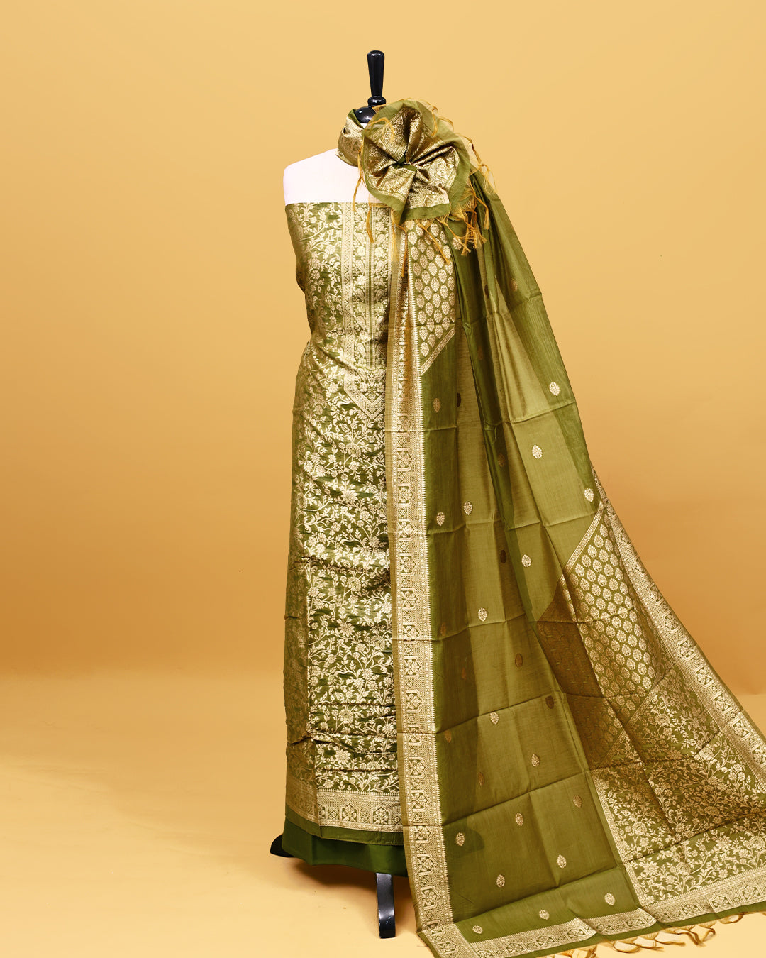 Olive colour Banaras Salwar material with gold zari floral kodi pattern work on body, matching bottom & Dupatta.