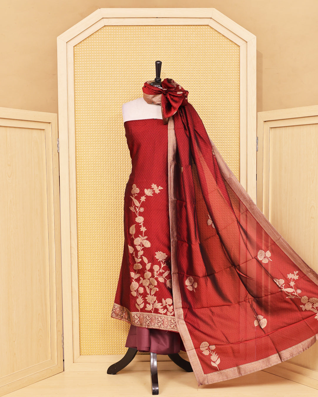 Red colour Banaras salwar material featuring Zari floral work on body, paired with Matching bottom & dupatta.