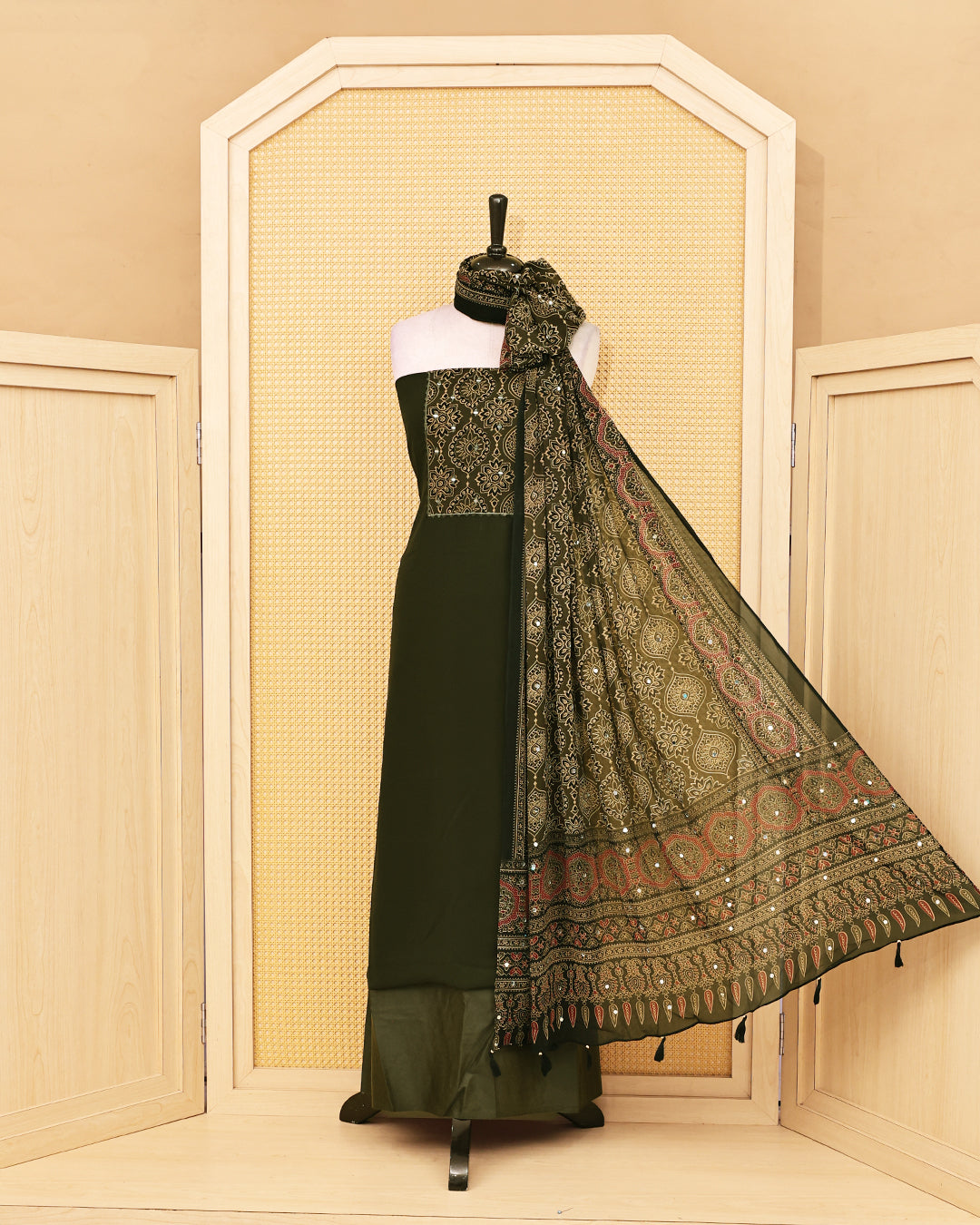 Olive Green colour Georgette Salwar material featuring Mirror with Design print work on body, paired with matching bottom & Dupatta.