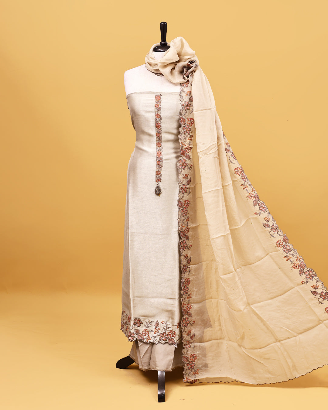 Beige colour Organza Salwar material with Thread work on body, matching bottom & Dupatta.