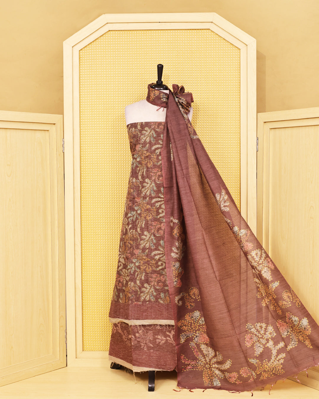 Brown colour organza Salwar Material featuring elegant floral prints on the kurta, paired with a matching bottom and a self coloured printed dupatta.