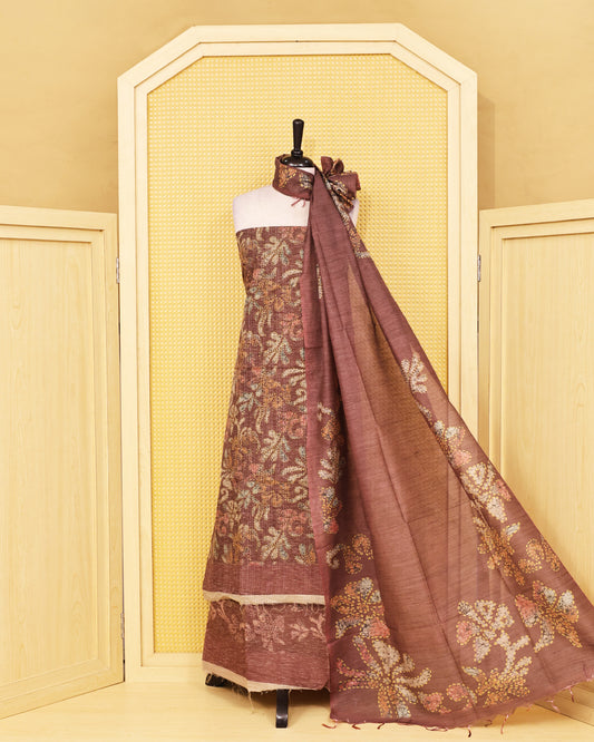 Brown colour organza Salwar Material featuring elegant floral prints on the kurta, paired with a matching bottom and a self coloured printed dupatta.
