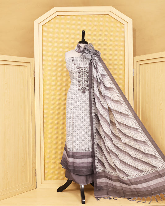 Off White colour Linen salwar material featuring Thread work with print on body, paired with Contrast Greyish beige colour bottom & dupatta.