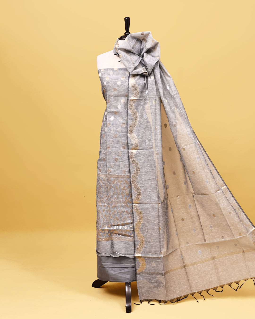 Grey colour linen Salwar material with Gold zari kodi pattern on body, matching bottom & Dupatta.