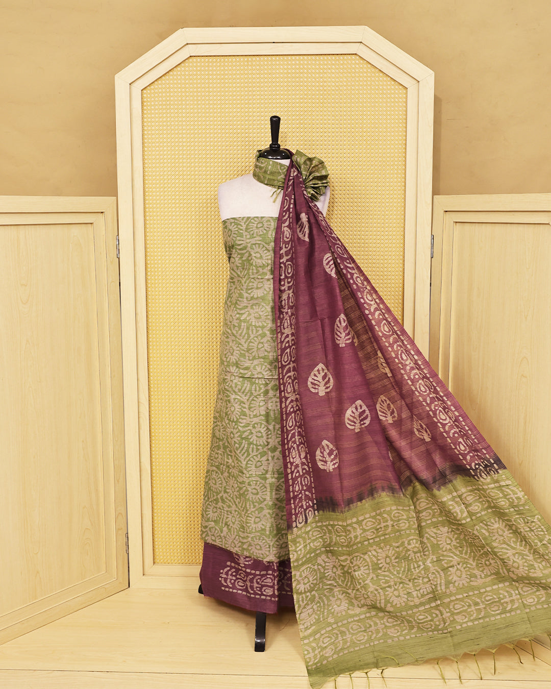 Green colour with Batik Printed  chanderi Salwar Material paired with a rich Plum Purple printed bottom and a matching contrast dupatta featuring traditional leaf motifs and artistic borders