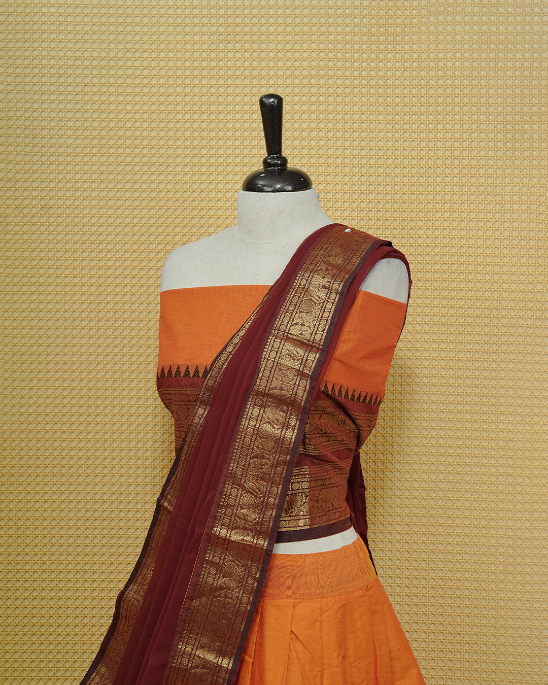 Orange colour Chettinad Semi Stitched dhavani set Featuring contrast Maroon with Gold zari border on skirt, Contrast Blouse & matching dupatta.