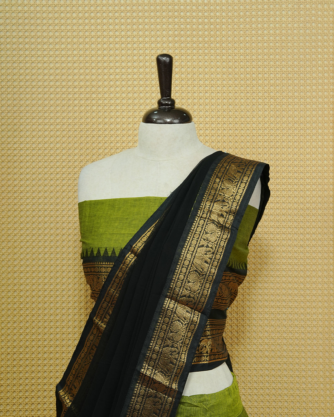 Green colour Chettinad Semi Stitched dhavani set Featuring contrast Black with Gold zari border on skirt, Contrast Blouse & matching dupatta.