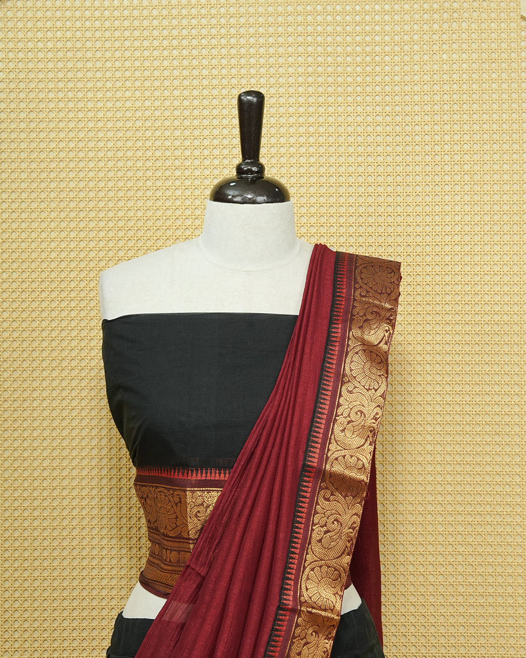 Black Colour chettinad cotton Semi stitched dhavani set featuring Contrast Maroon with Gold zari border skirt, comes with Matching blouse piece & dupatta.