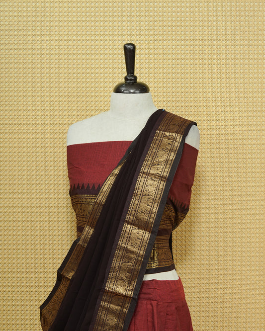 Maroon colour Chettinad Semi Stitched dhavani set Featuring contrast Black with Gold zari border on skirt, Contrast Blouse & matching dupatta.