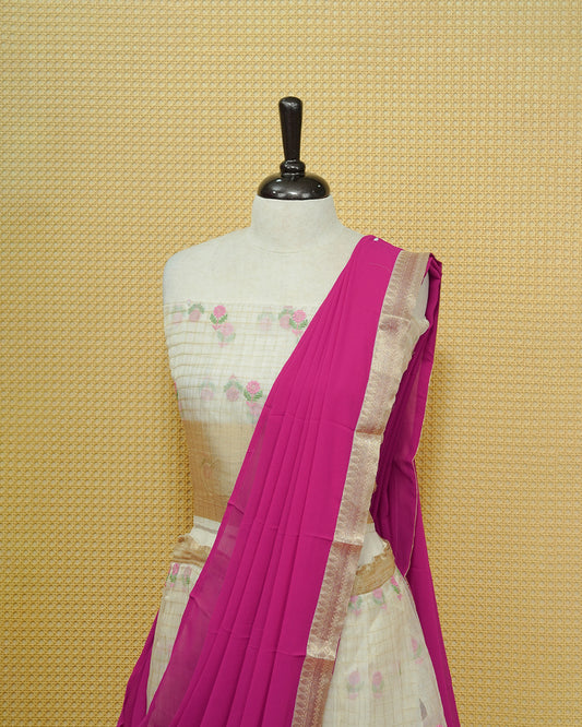 Cream colour Semi stitched Dhavani set featuring Gold zari checked pattern with floral motifs on skirt with traditional border, comes with contrast Colour Dupatta & matching blouse piece.