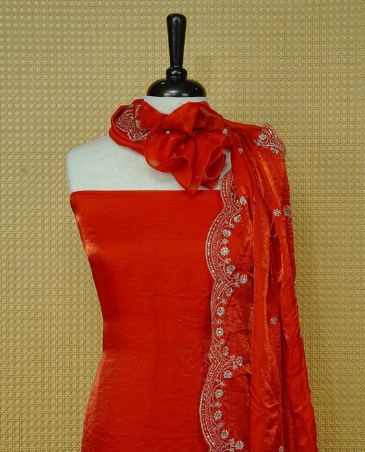 Orange colour Fendy silk salwar material With Elegant plain body with lining, Comes with santoon bottom, Fendy silk dupatta With Floral buttas & Scalp Border.