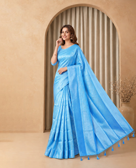 Light Blue Colour Elite Soft Silk Saree with silver zari leaf motifs on the body, a self Banarasi silver zari border and brocade pallu, Paired with a blouse Piece featuring small silver zari buttas.