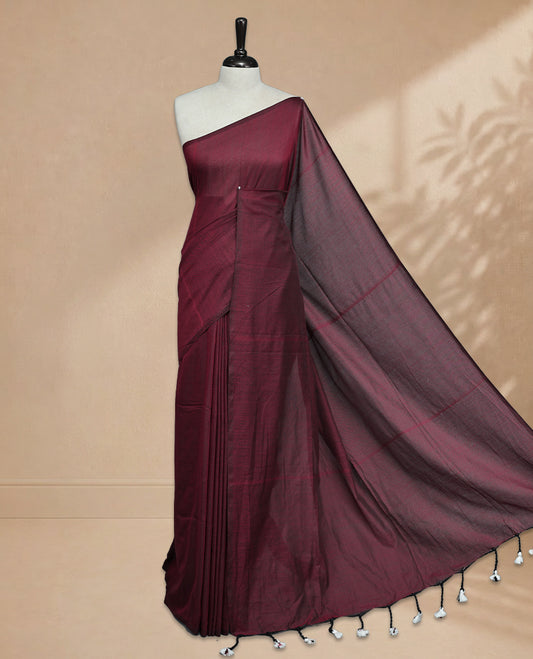 Red Colour Mul Cotton saree featuring Elegant plain body, Comes with no border, finished with stylish tassels.