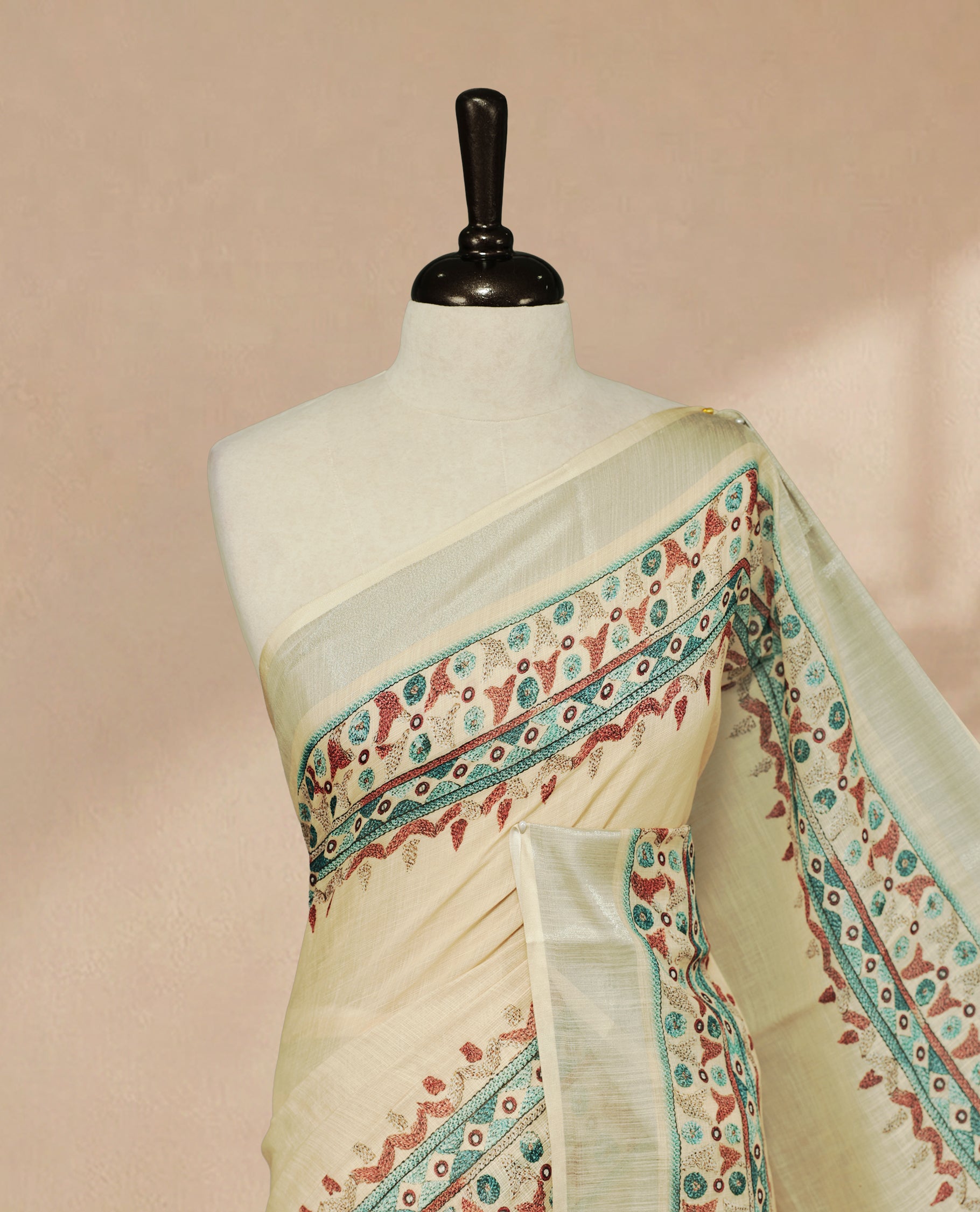 Beige Colour Semi Linen colour saree featuring Thread buttas on body & border, paired with matching blouse piece thread worked border.