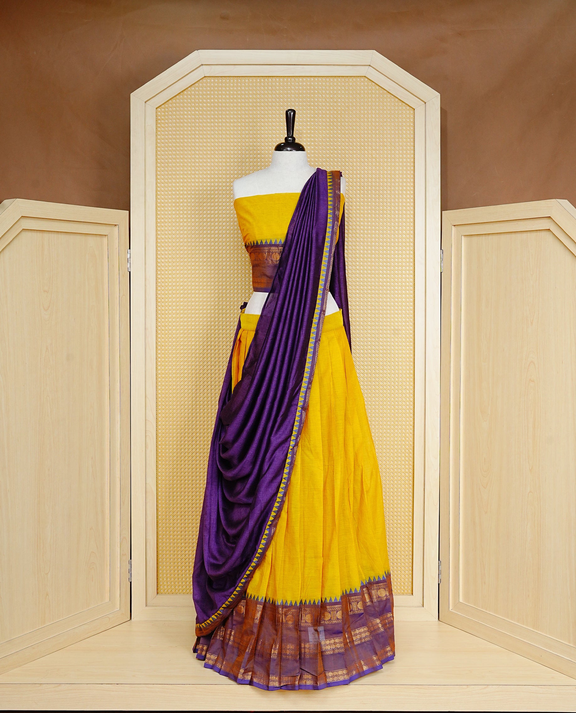 Lemon colour Semi Stitched Dhavni set Featuring Lemon Skirt With Contrast Purple colour with Zari border, paired with UnStitched Blouse & Elegant Dupatta.