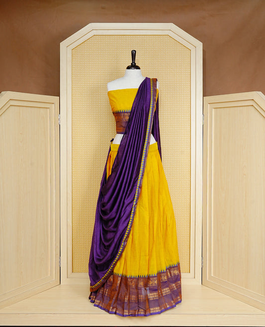 Lemon colour Semi Stitched Dhavni set Featuring Lemon Skirt With Contrast Purple colour with Zari border, paired with UnStitched Blouse & Elegant Dupatta.