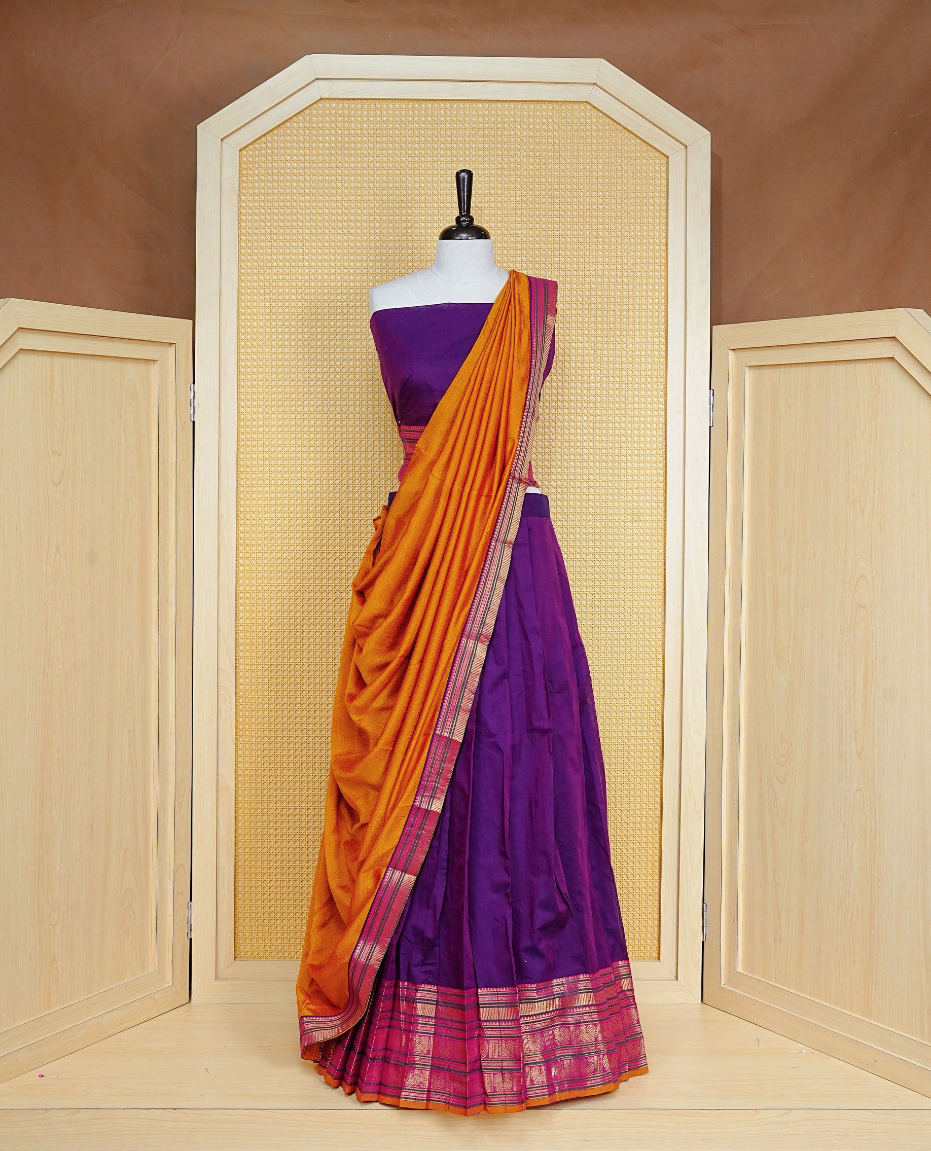 Purple colour Semi Stitched Dhavni set Featuring Purple Skirt With Contrast Mustard, Green & magenta colour with Zari border, paired with UnStitched Blouse & Elegant Dupatta.