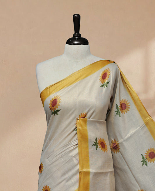 Butter Cream colour Linen Tissue Saree featuring Sunflower Print, small & Big floral print & contrast border, Comes with Contrast Self Printed Blouse.