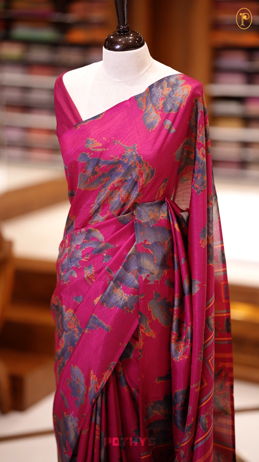 Magenta & Green colour semi silk saree enhanced with a vibrant  floral prints on body & pallu, and comes with a self printed blouse.