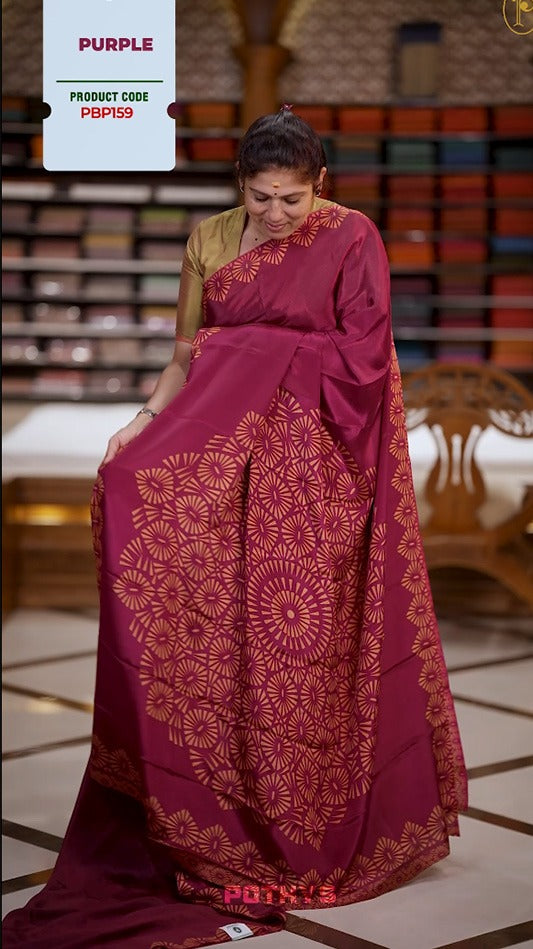 Maroon and mustard yellow colour Turkey crepe saree with an bigcircle fancy print on the pallu, stylish printed border, and matching blouse.