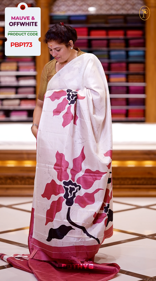 Mauve colour saree adorned with bold off white & black floral prints, blending tradition with a modern twist & paired with a matching blouse.