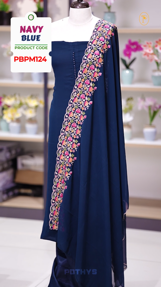 Navy blue colour Chiffon churidhar material featuring a plain top adorned with delicate beads work on the neckline, paired with a plain bottom, Highlighted by a dupatta with floral embroidery, sequins, and scalloped edges.