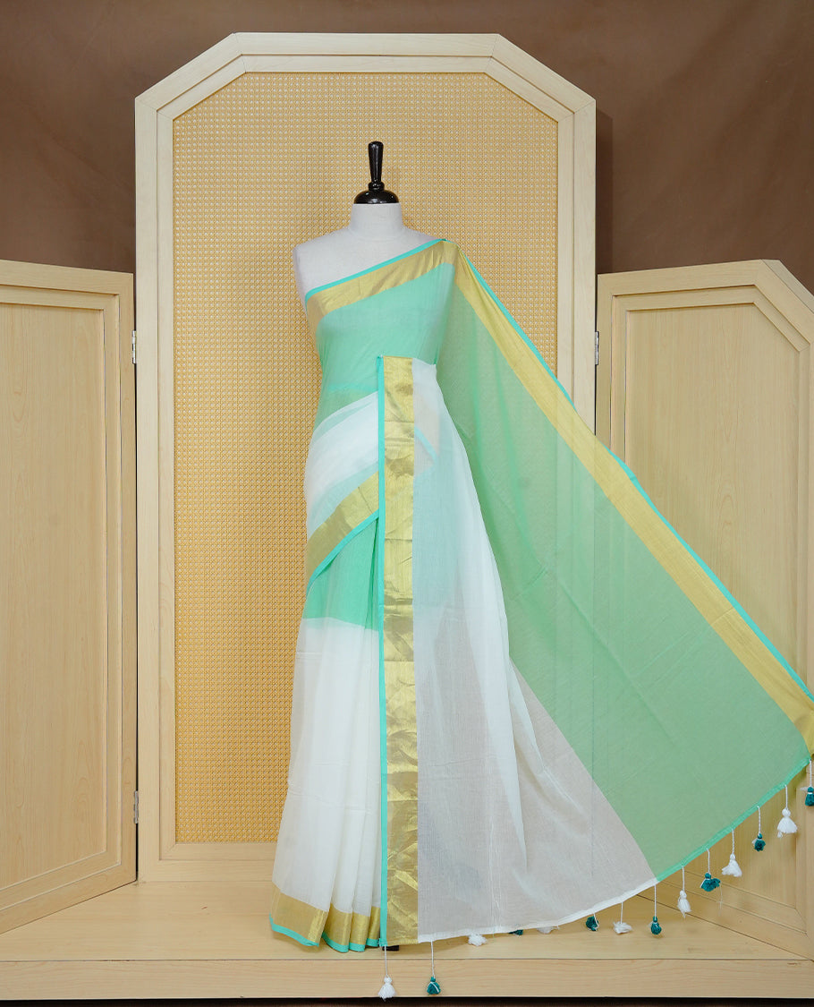 Pastel Mint with White Dual colour Mul cotton saree featuring Half & Half Dual Tone Plain Body, Complemented by Gold tissue Border & pallu.