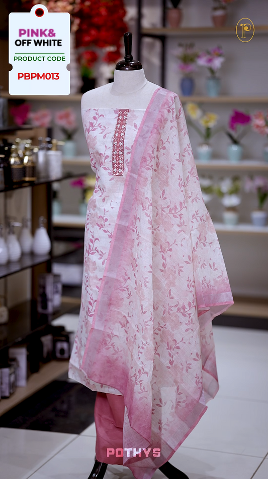 Off white colour jute cotton salwar material with pink leaf prints, featuring embroidery and mirror work on the neckline, paired with a printed dupatta and a contrast pink bottom for a graceful and elegant look.
