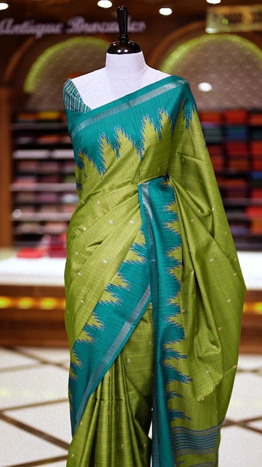 Pista green colour saree with a vibrant green pallu and border featuring sharp zigzag motifs, Subtle woven dots grace the body & Comes with a matching blouse.