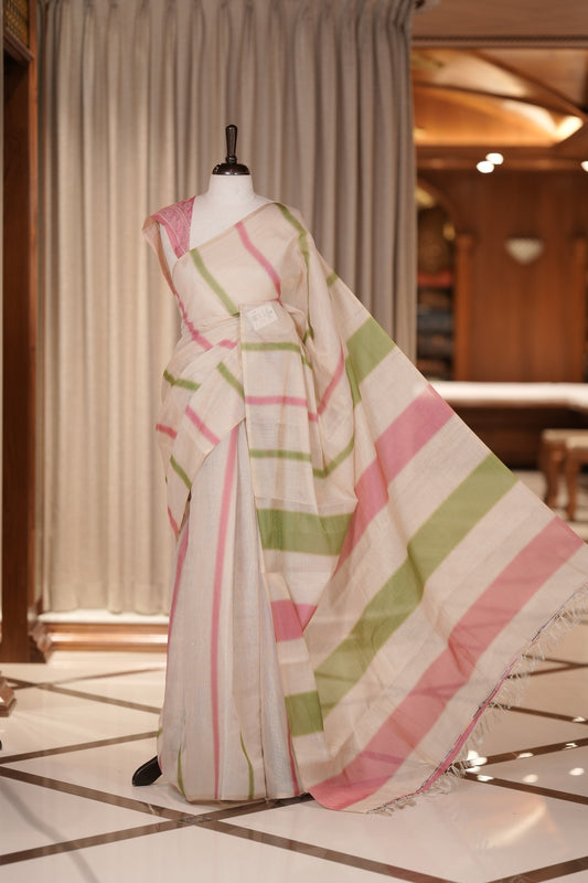 Pista green & Pink colour Linen printed saree featuring stylish fancy line prints all over, paired with a contrast colour printed blouse and a beautifully designed fancy line pallu.