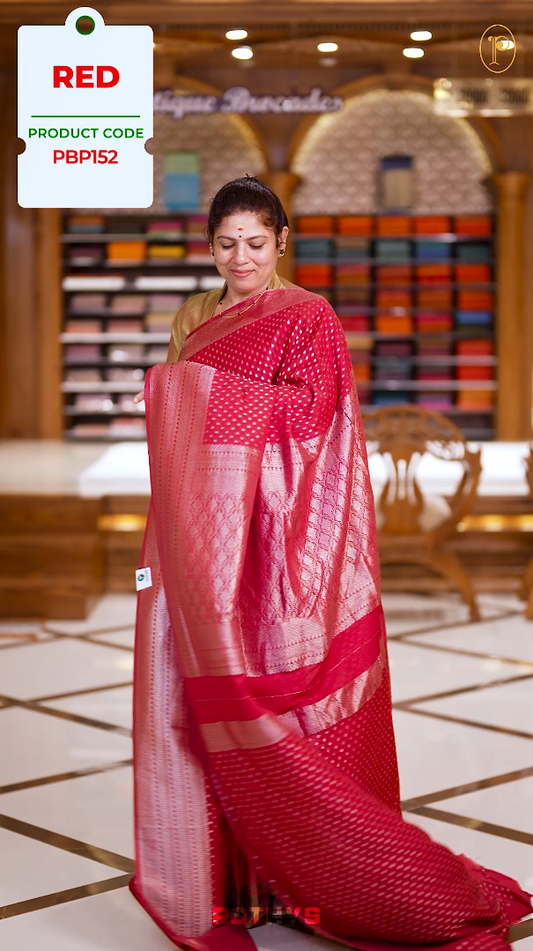 Red colour Semi Banaras georgette saree adorned with delicate silver zari motifs and a rich woven pallu & Comes with a  matching  blouse.